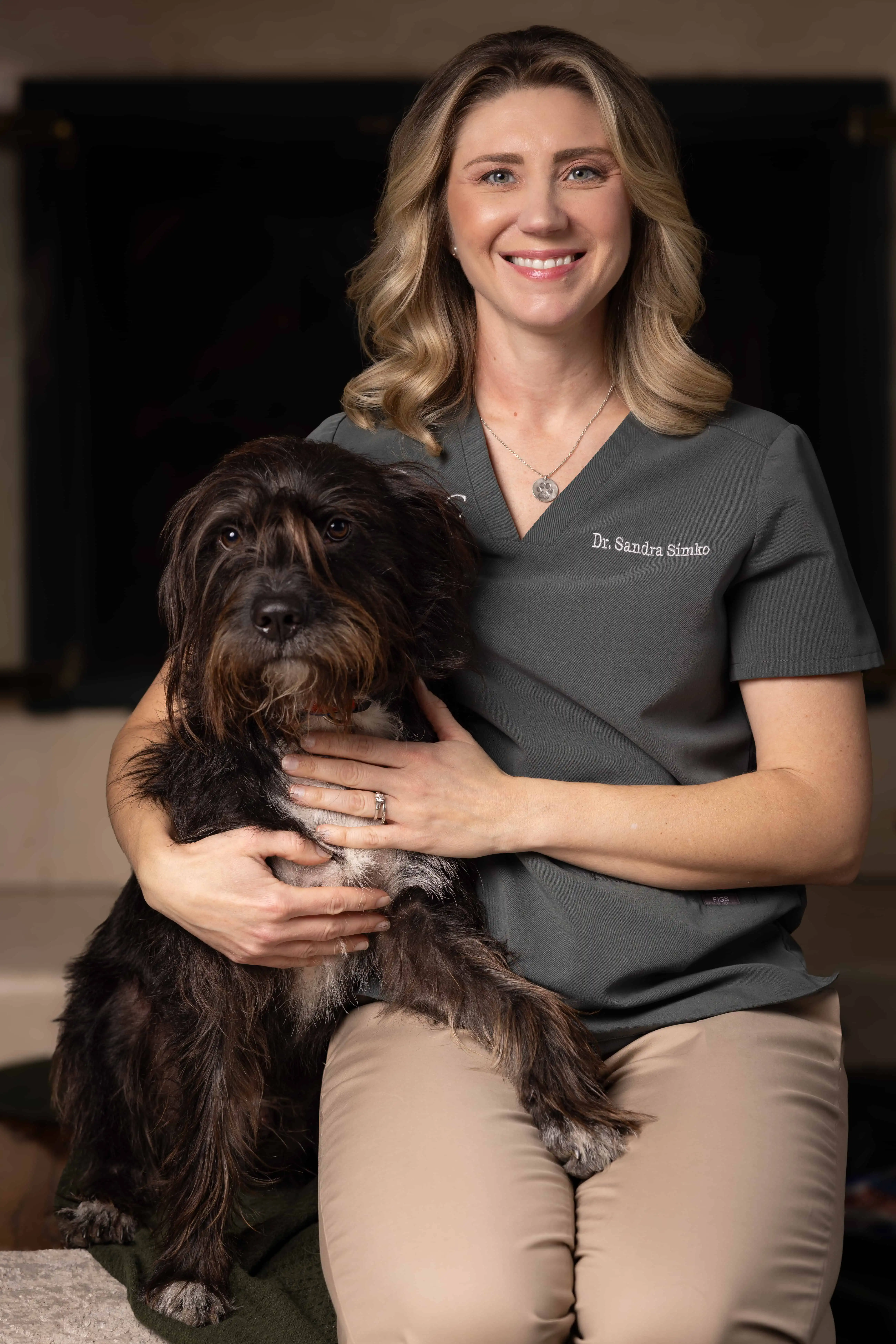Dr. Sandra In Home Pet Euthanasia. Vet with dog